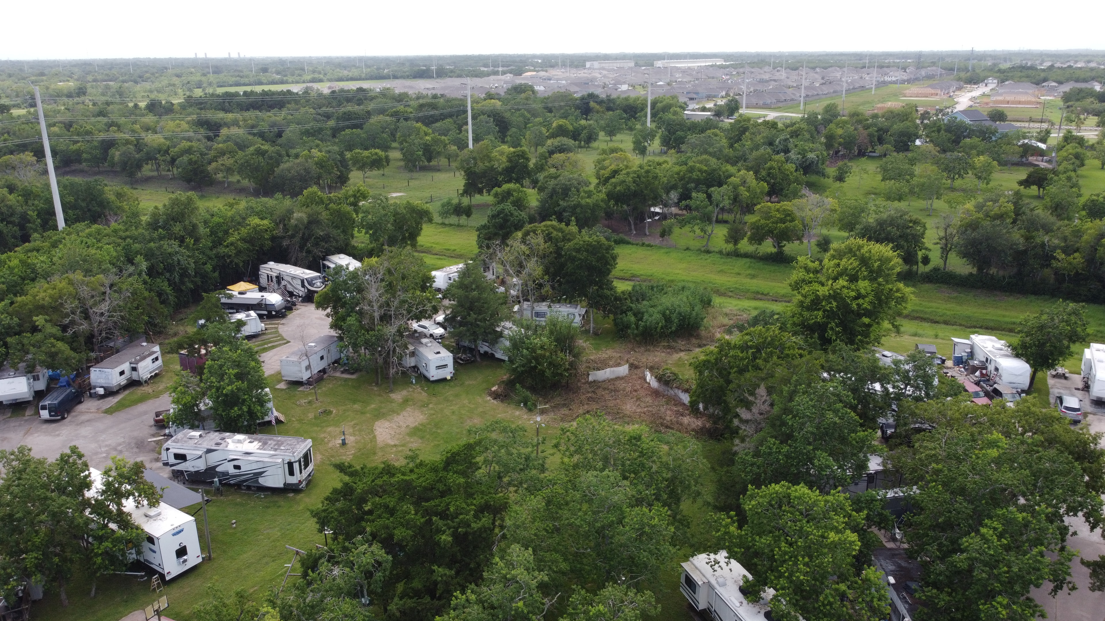 Wide aerial view of Little Thicket RV Resort and surrounding area