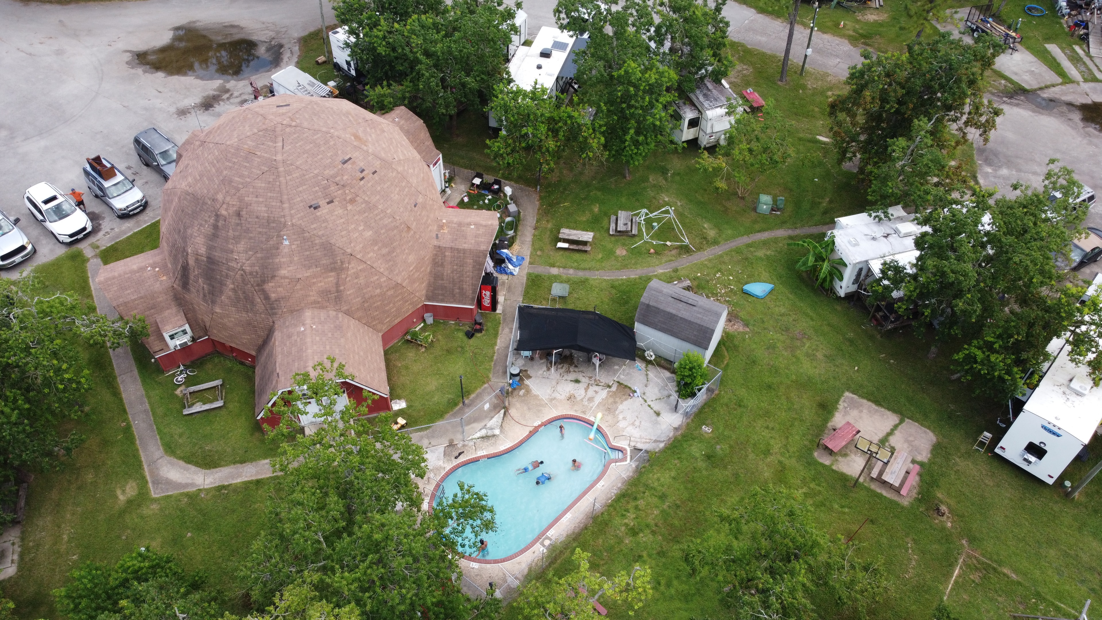Aerial drone photo of Little Thicket RV Resort pool area